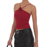 Red one-shoulder top with a floral detail worn by a model
